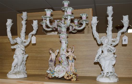 Pair of Dresden style blanc-de-chine figural candelabra and a 7-light candelabrum mounted with putti (damage & repairs)